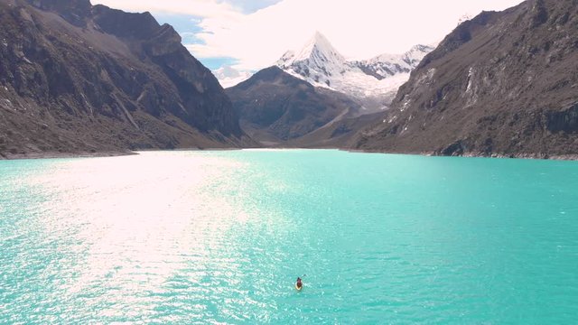 Paron lake reversal fly, couple kayakin in middle of the lake, aerial shoot