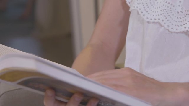 Female reading a book at home