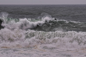 Aerial view of  surfer riding big wave on the North Shore, Hawaii. Drone Photo