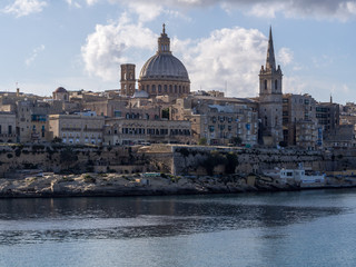 Fototapeta na wymiar Sea view of Valletta city - the capital of Malta with Basilica of Our Lady of Mount Carmel in Valletta, Malta.