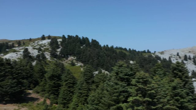 The beautiful green mountain landscape of the Eubea Island in Greece - wide pan