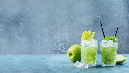 Green cocktail with ice and mint