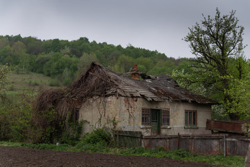 Fototapeta na wymiar the old abandoned house is falling apart