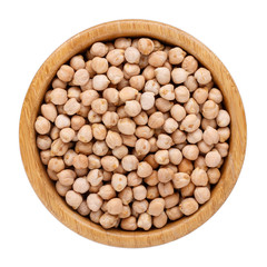 Dried chickpeas in wooden bowl isolated on white. Top view.