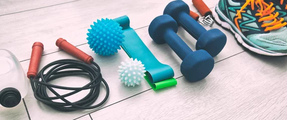 Rollo The fitness tools and  a equipment on the wooden floor. Concept of home physical training and staying at home © SkyLine