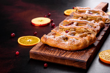 Delicious fresh pie baked with apple, pears and berries