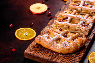 Delicious fresh pie baked with apple, pears and berries