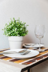 Arranging dinner tables in the dining room at home