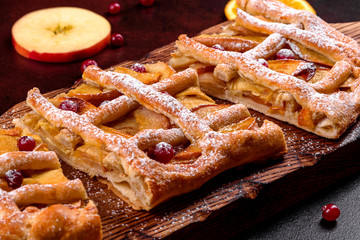 Delicious fresh pie baked with apple, pears and berries
