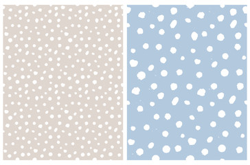 Simple Rough Dotted Seamless Vector Patterns. White Hand Drawn Brush Dots Isolated on a Light Beige and Pastel Blue Background.Infantile Style Geometric Repeatable Print.Irregular Polka Dots Backdrop.