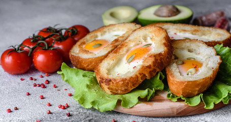 Delicious breakfast with grunts, eggs, avocado and cherry tomatoes