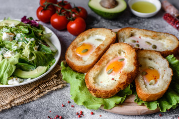 Delicious breakfast with grunts, eggs, avocado and cherry tomatoes