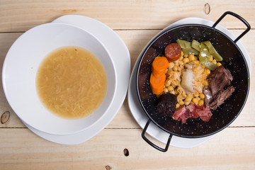Cocido madrileno, chickpea and pork stew. Plate, food.