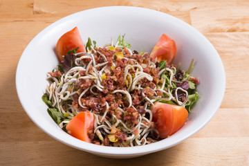 Angulas with tomatoes is a typical tapas dish.