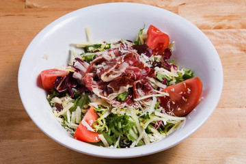 Vegetable salad with ham and cheese
