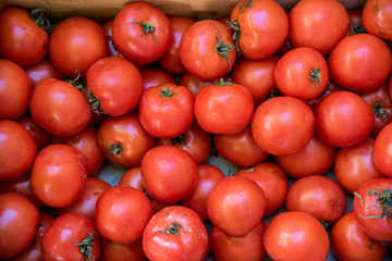 Variety old organic tomatoes on a market