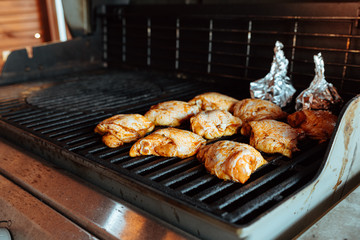 Grilling chicken thighs on a gas grill

