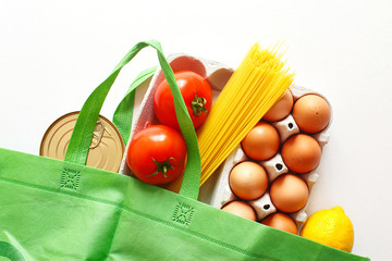 Full green bag of healthy products food on a white background. Top view. online shop. your text. food delivery