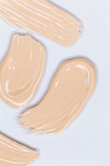 Makeup foundation smudges isolated on white background