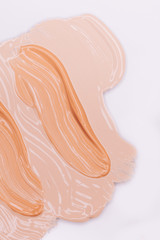 Makeup foundation smudges isolated on white background