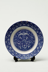 Ceramic plate painted by hand. Blue ceramic plate that can also be used as a decoration element. Ceramic plate used as ornaments. Handmade ceramic plate for collection.