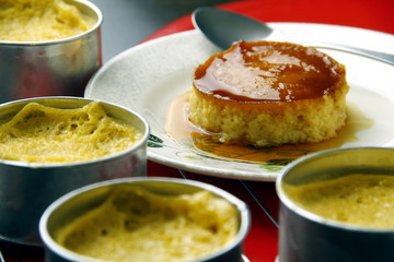 Photo of freshly cooked Leche Flan on a table.
