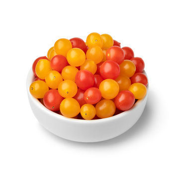 Bowl with red and yellow Tomberry tomatoes close up