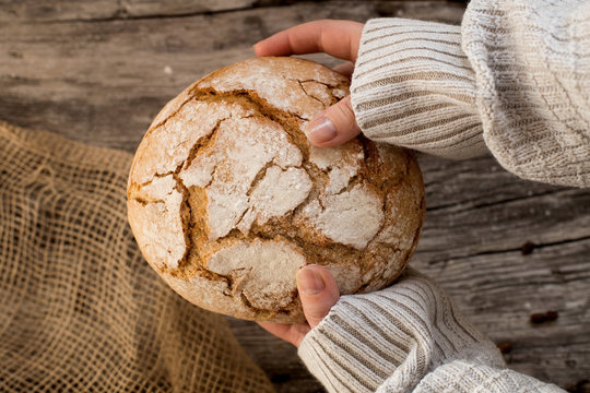 fresh home-made bread. rustic atmosphere. on the background of the old table