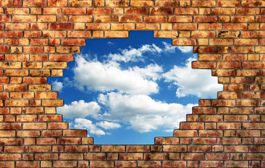 Brick wall with breaktrough and sky