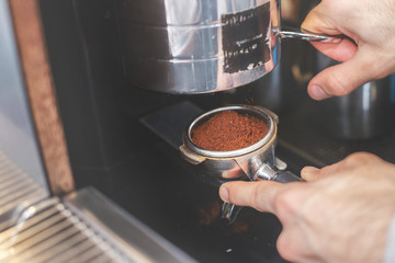 Fototapeta na wymiar Barista making coffee with latte art. black coffee morning on coffee machine