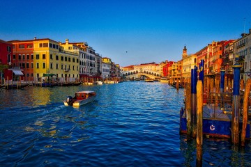 boats and the Rialto bridge on the Grand Canal in Venice, Italy
