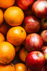 Set of oranges and ripe red apples. Set of very appetizing fruits.