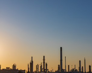 Fototapeta na wymiar Industrial landscape, factory building in the Netherlands. Heavy industry in Europe, petrochemical industrial plant power station at sunset, pollution from smokestacks, ecology problems.