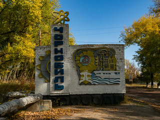 Town sign at the entrance of the abandoned city of Chernobyl in the Ukraine, the sign shows the...