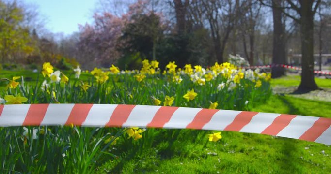 Barrier Tape - closed public park - camera pan - ProRes