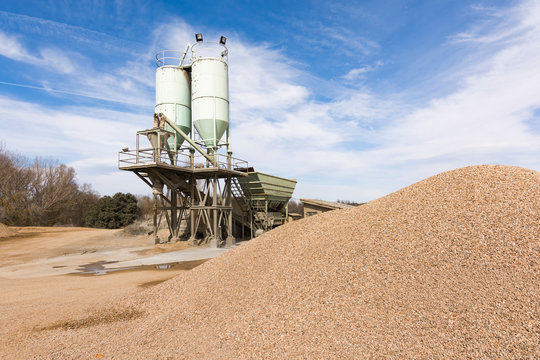 Quarry aggregate with heavy duty machinery.