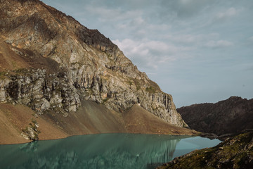 Kyrgyzstan. Alakel Lake. The mountain lake is bruise in the midst of high mountains.