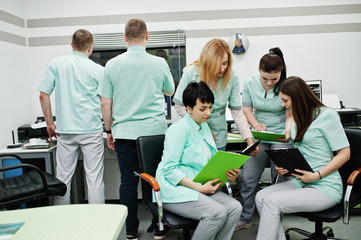 Medical theme.Observation room with a computer tomograph. The group of female doctors with...