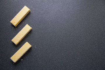 Crispy waffles on a gray table.