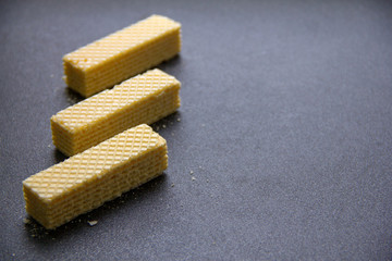 Crispy waffles on a gray table.
