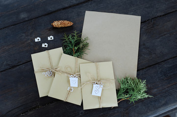 Brown kraft envelopes tied with an old tourniquet on old wood background with copy space. Handmade...