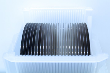Close up of Silicon wafers grey color prepared for production in a semiconductors manufacturing facility