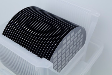 Close up of Silicon wafers grey color with chip cells prepared for production in a semiconductors manufacturing facility