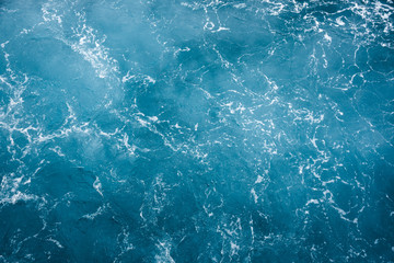 Blue ocean water texture, surface. Top view of aqua blue clear sea ocean. Beautiful blue sea water...