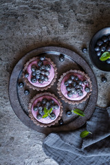 Chocolate tartlets filled with blueberry mascarpone cream