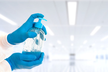 hydro alcoholic soap in diffuser boat on hands with blue gloves