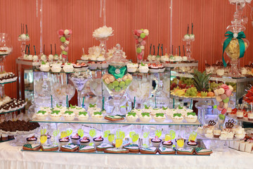 Candy bar on wedding ceremony with a lot of different candies and beverages