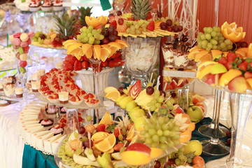 Candy bar on wedding ceremony with a lot of different candies and beverages