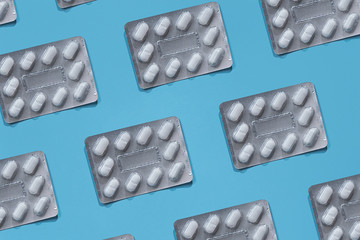 Set of pills on a blue background