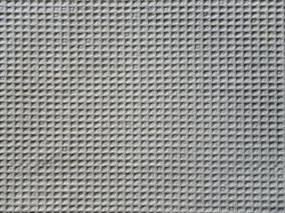 beige fabric material with strong texture, square pattern, close-up